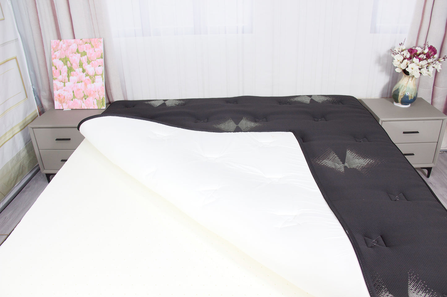 Black mattress encasement made from premium cotton with a zippered closure for full mattress protection.