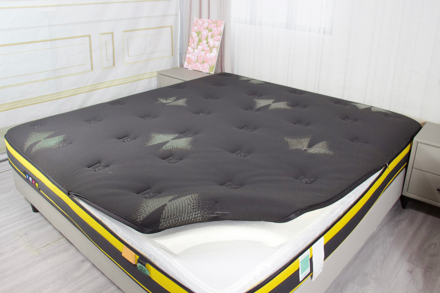 Black mattress encasement made from premium cotton with a zippered closure for full mattress protection.