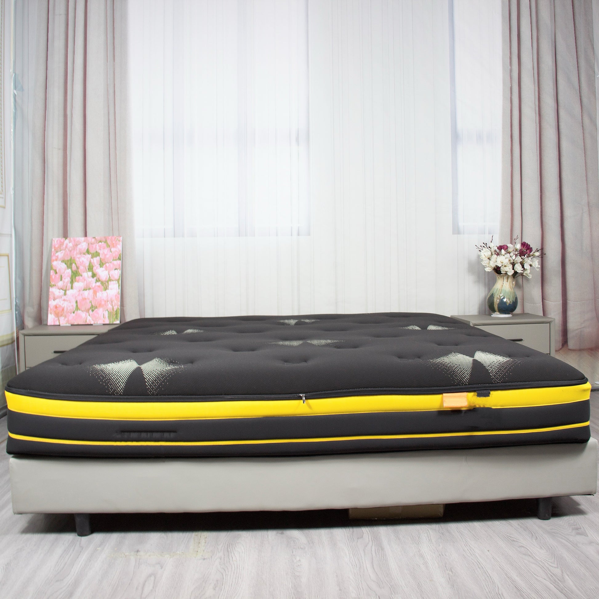 Black mattress encasement made from premium cotton with a zippered closure for full mattress protection.